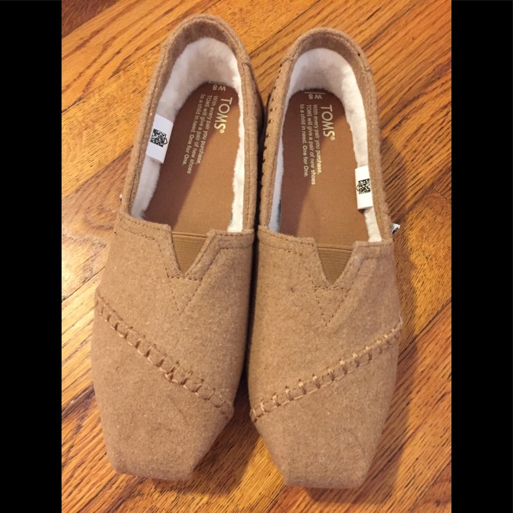 Toms classic slip-ones with faux shearling lining